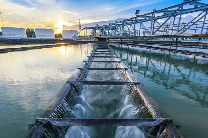 Water treatment plant process at sunset